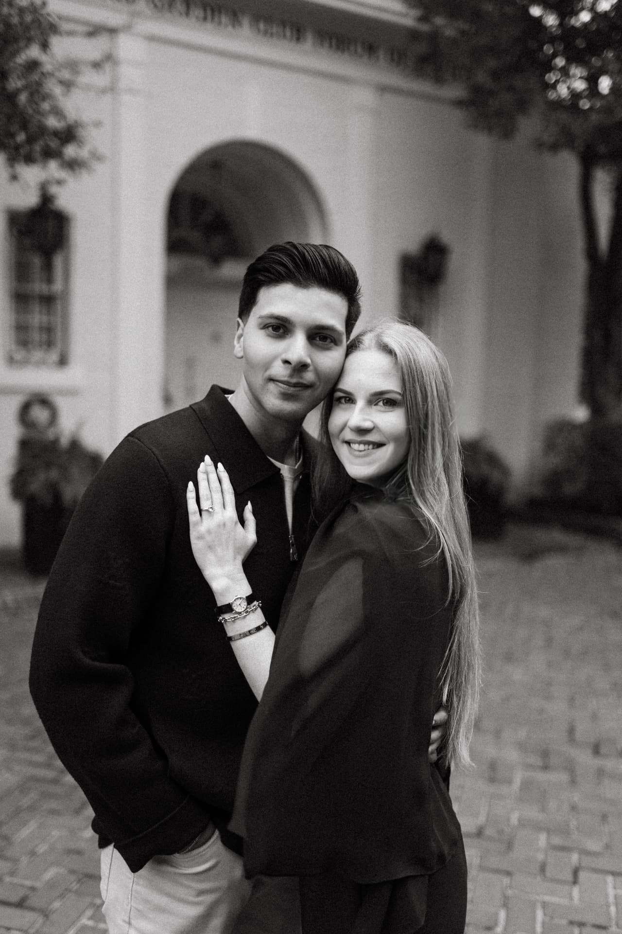 A black and white portrait of Wasi and Hope together, her hand resting on his chest